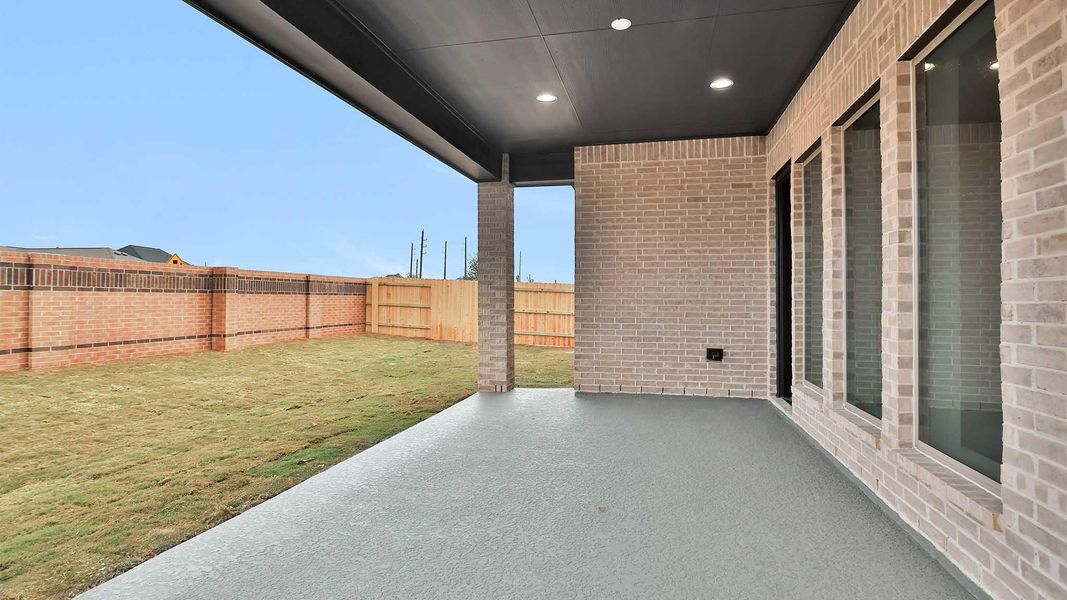 Exterior details and patio area of a home in Elyson 55', Katy (Image 3).