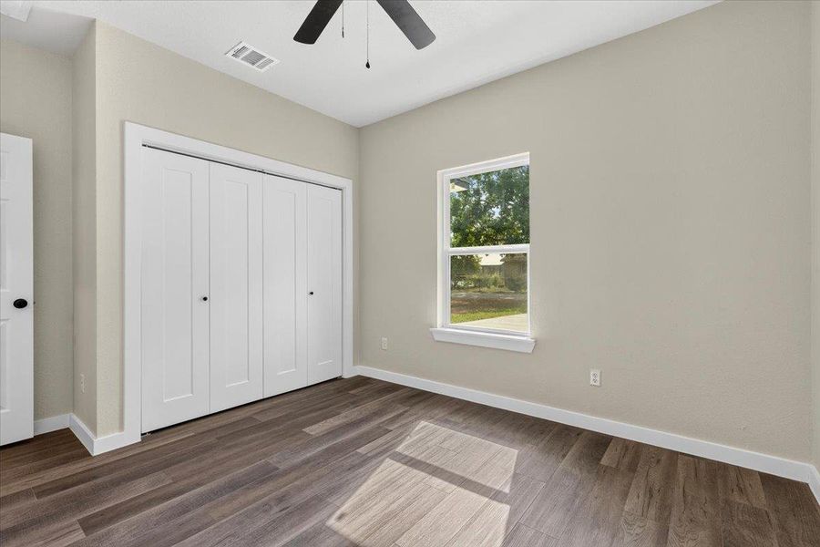 Smooth plaster walls and dark wood-plank flooring define this quiet, light-filled bedroom. Smooth plaster walls and dark wood-plank flooring define this quiet, light-filled bedroom.