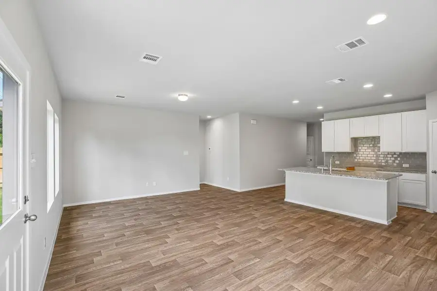 Picture cozy gatherings in a living area that encourages laughter, while the sleek kitchen—equipped with state-of-the-art appliances—beckons culinary adventures and family dinners.