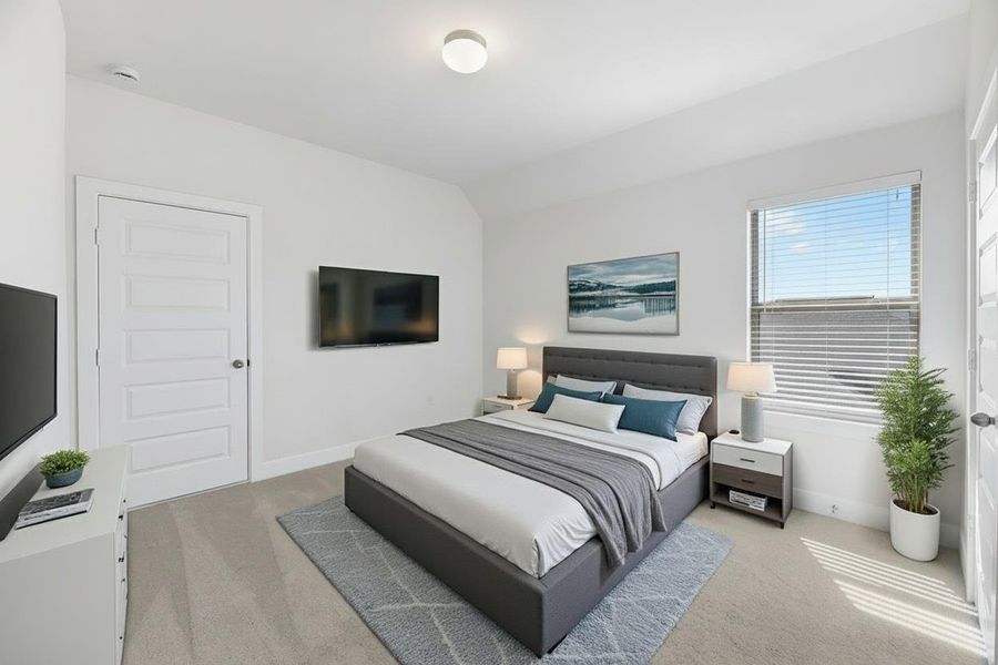 Bedroom with light carpet and vaulted ceiling