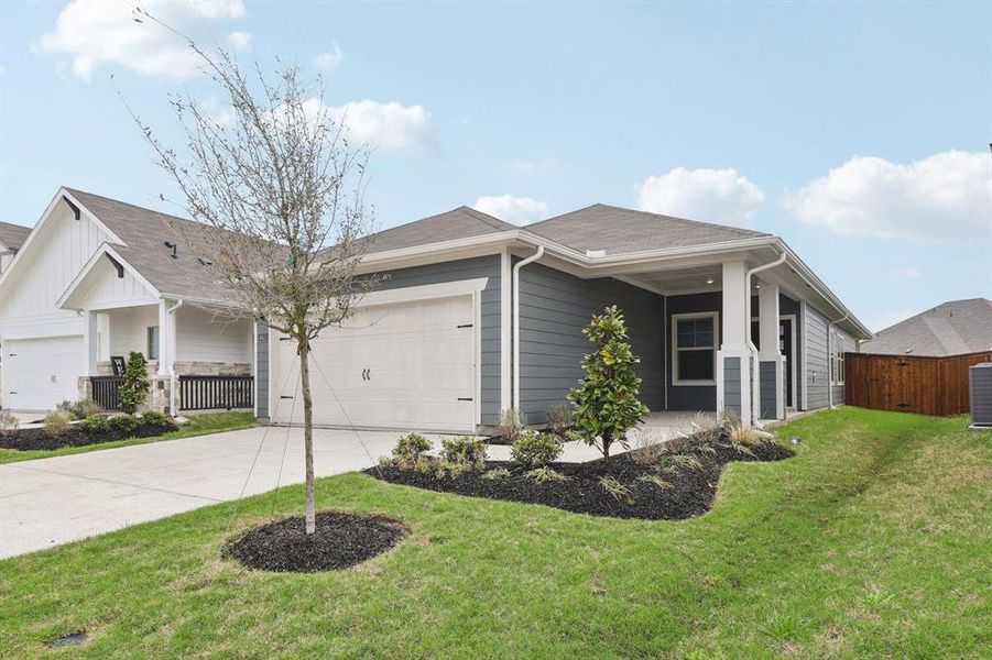 Front exterior of a new home in Lakehaven - Spring Series, Farmersville, TX, highlighting curb appeal (Image 2). Front exterior of a new home in Lakehaven - Spring Series, Farmersville, TX, highlighting curb appeal (Image 2).