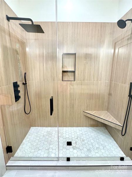 Large shower with duel shower heads and sprayers