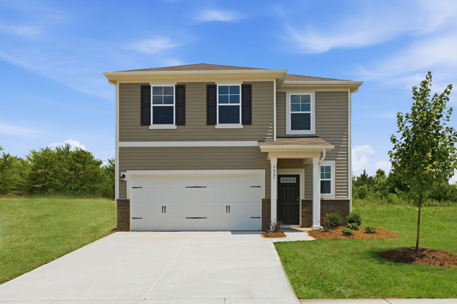 Front exterior of a new home in Meadow Creek Village, Locust, NC, highlighting curb appeal (Image 1). Front exterior of a new home in Meadow Creek Village, Locust, NC, highlighting curb appeal (Image 1).