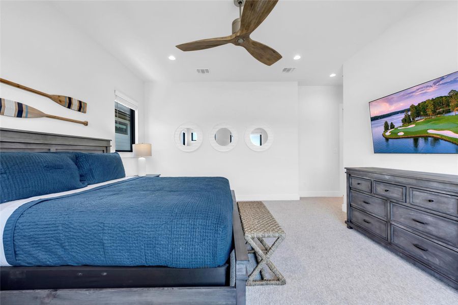 Bedroom four: Crisp white walls and plush carpeting create a serene and relaxing bedroom retreat.