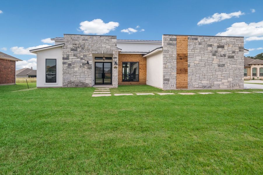 Representative exterior photo of a completed home built from the The Scottsdale 5000 by Whitestone Custom Homes in Johnson Ranch, Bulverde, TX (Image 22).
