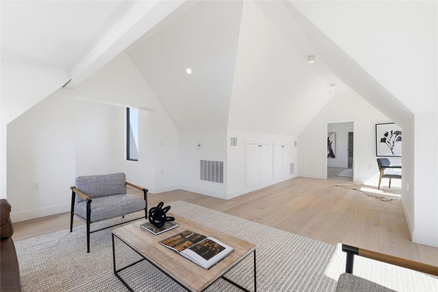 Discover a naturally illuminated loft with vaulted ceilings and pristine hardwood flooring. Discover a naturally illuminated loft with vaulted ceilings and pristine hardwood flooring.