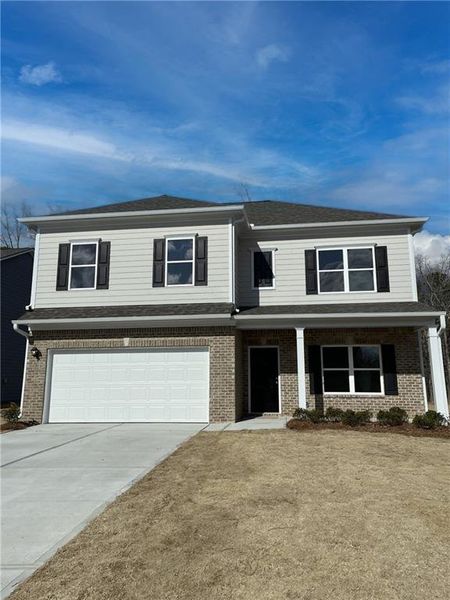 Front exterior of a new home in Emerald Oaks Estates, Rome, GA, highlighting curb appeal (Image 14).