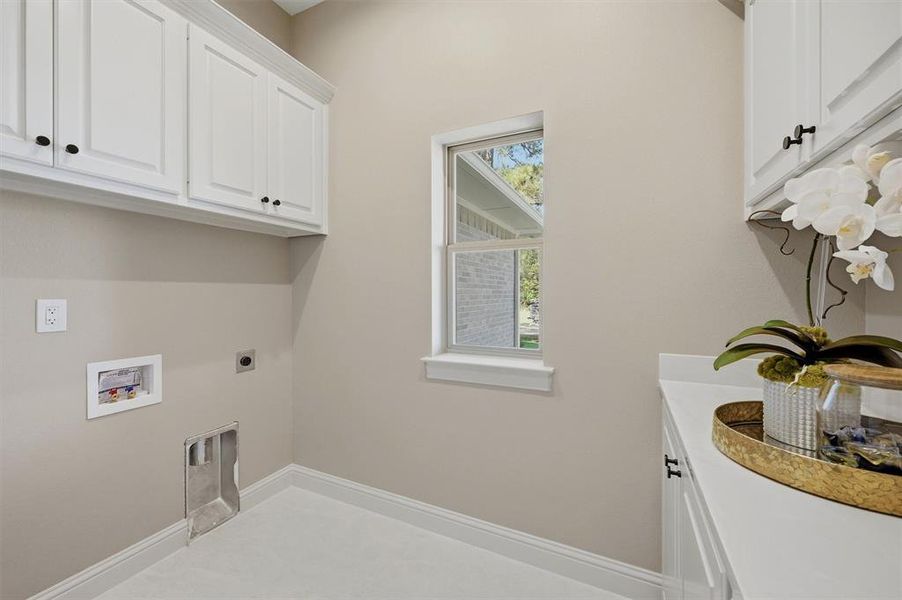 Landury room and more storage and cabinets