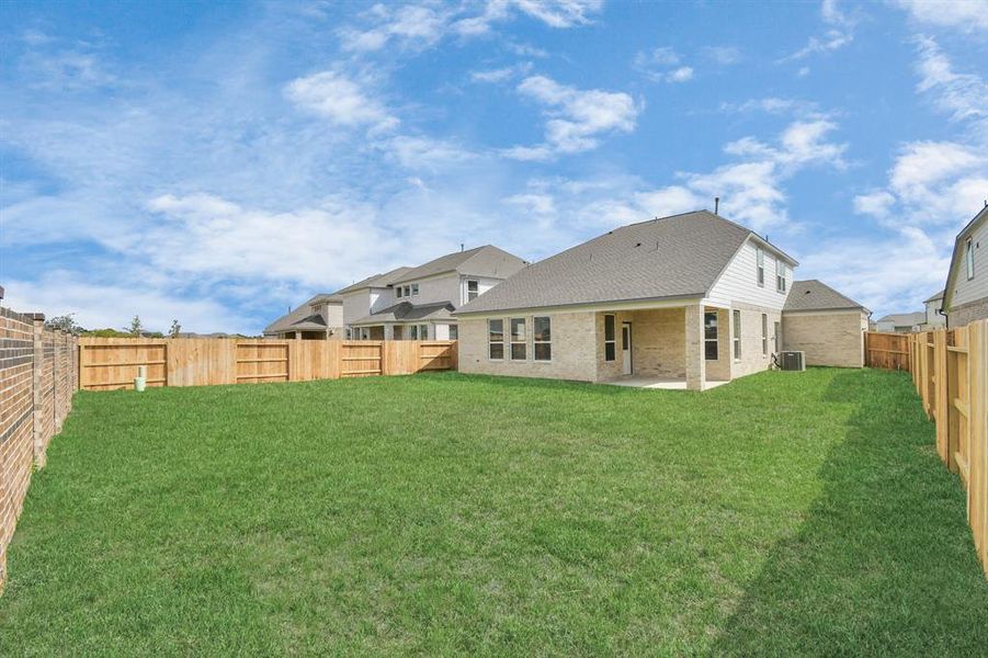 Experience outdoor living at its finest on this expansive covered patio.