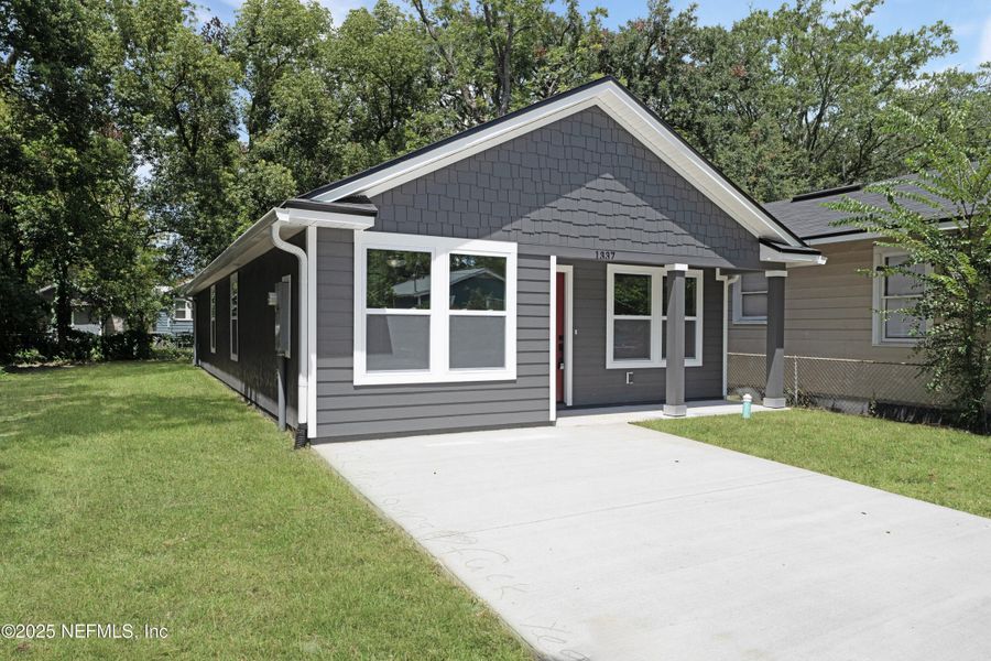 Front exterior of a new home in , Jacksonville, FL, highlighting curb appeal (Image 1). Front exterior of a new home in , Jacksonville, FL, highlighting curb appeal (Image 1).