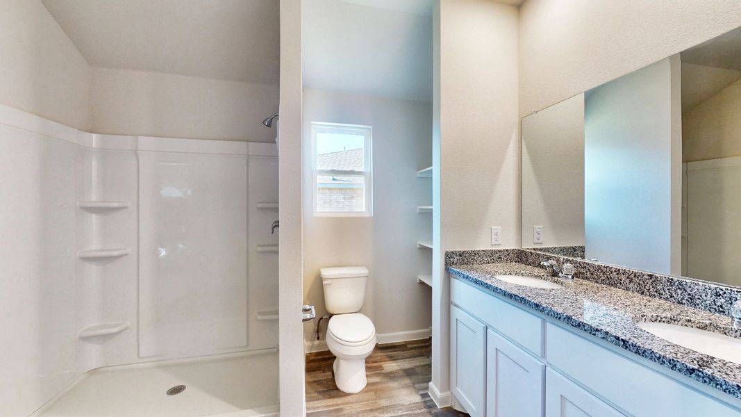 A bathroom with a marble countertop. A bathroom with a marble countertop.