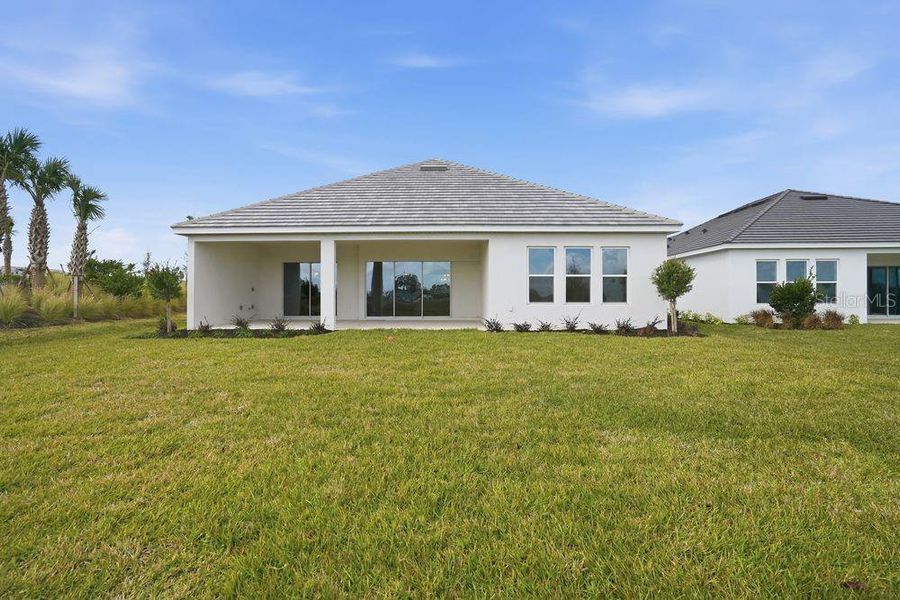Exterior details and patio area of a home in Coasterra Community Group Page, Palmetto (Image 23).