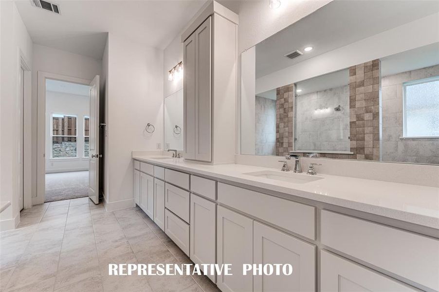 With his and her vanities, there is plenty of room for 2 in this lovely owner's bath. REPRESENTATIVE PHOTO. With his and her vanities, there is plenty of room for 2 in this lovely owner's bath. REPRESENTATIVE PHOTO.