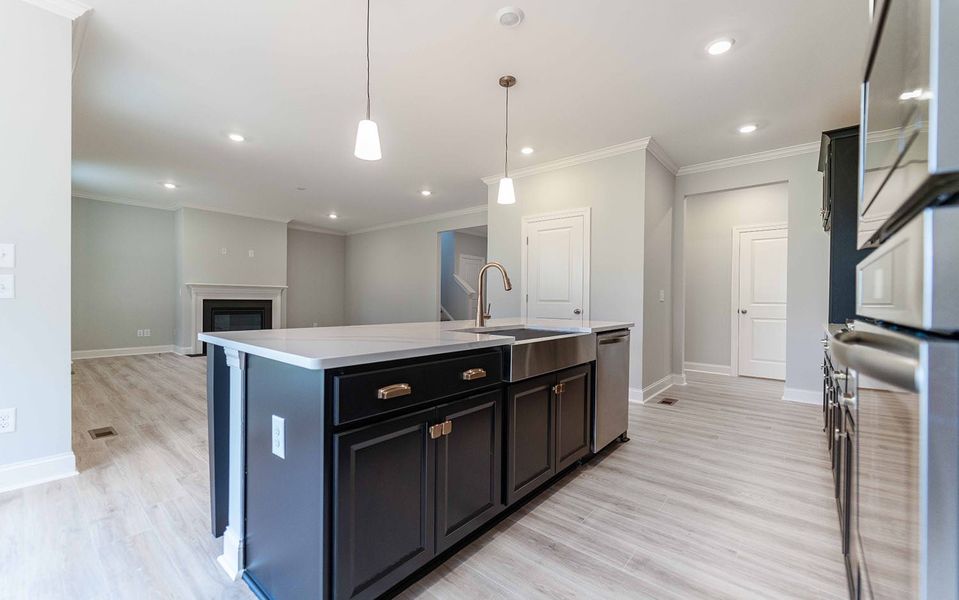 Furnished interior view inside a new home in Aden Woods, Fairview (Image 7).