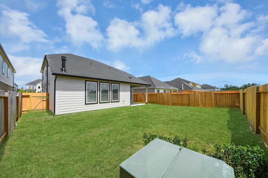 Come and see this spacious backyard with its beautiful covered patio. There is plenty of room for the kids to play and adults to relax. Perfect for your outdoor living space, patio furniture, bbq pit, and so much more. The possibilities are endless!