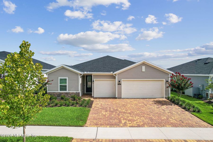 Front exterior of a new home in Edenbrooke at Hyland Trail | 55+, Green Cove Springs, FL, highlighting curb appeal (Image 26). Front exterior of a new home in Edenbrooke at Hyland Trail | 55+, Green Cove Springs, FL, highlighting curb appeal (Image 26).