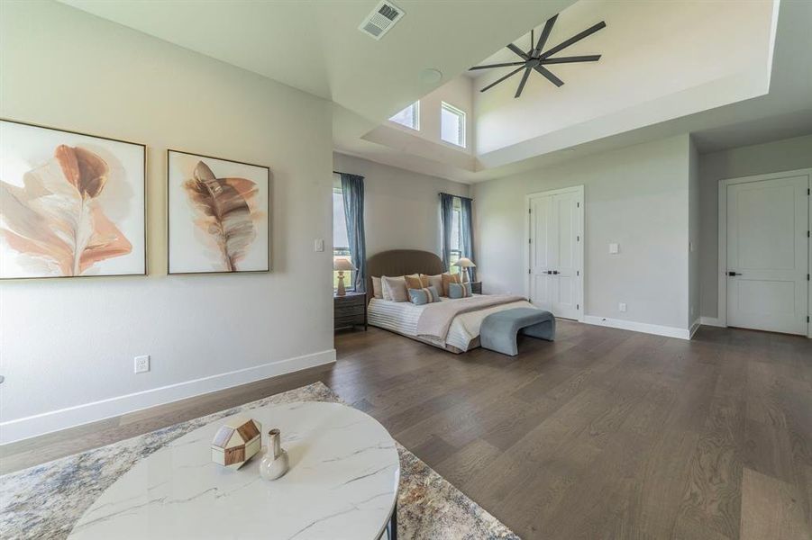 Bedroom with baseboards and dark wood-style floors Bedroom with baseboards and dark wood-style floors