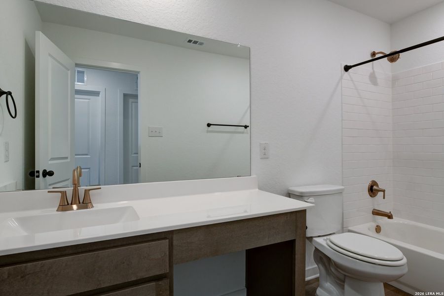 Furnished interior view inside a new home in Nopal Valley, San Antonio (Image 13).