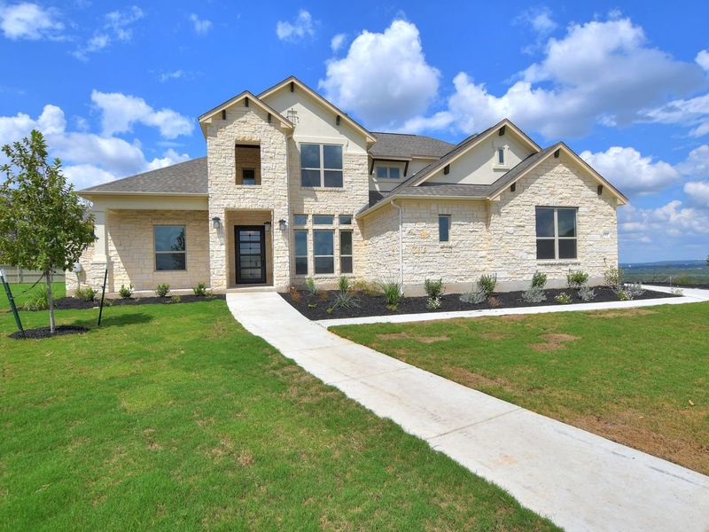 Representative exterior photo of a completed home built from the Madera II by Giddens Homes in Scofield Farms Estates, Georgetown, TX (Image 51).