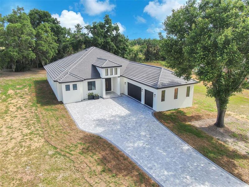 Front exterior of a new home in , Thonotosassa, FL, highlighting curb appeal (Image 27).