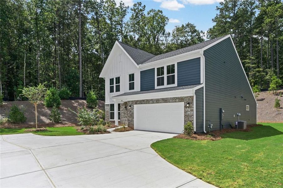 Front exterior of a new home in Easton Park, Dallas, GA, highlighting curb appeal (Image 25). Front exterior of a new home in Easton Park, Dallas, GA, highlighting curb appeal (Image 25).