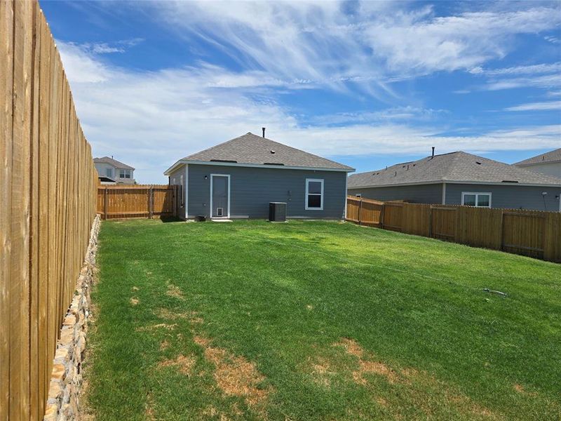 Front exterior of a new home in Big Sky Estates, Ponder, TX, highlighting curb appeal (Image 16).