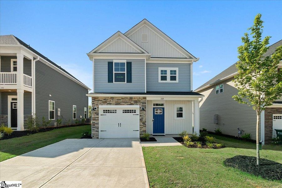 Front exterior of a new home in Halton Oaks, Spartanburg, SC, highlighting curb appeal (Image 1). Front exterior of a new home in Halton Oaks, Spartanburg, SC, highlighting curb appeal (Image 1).