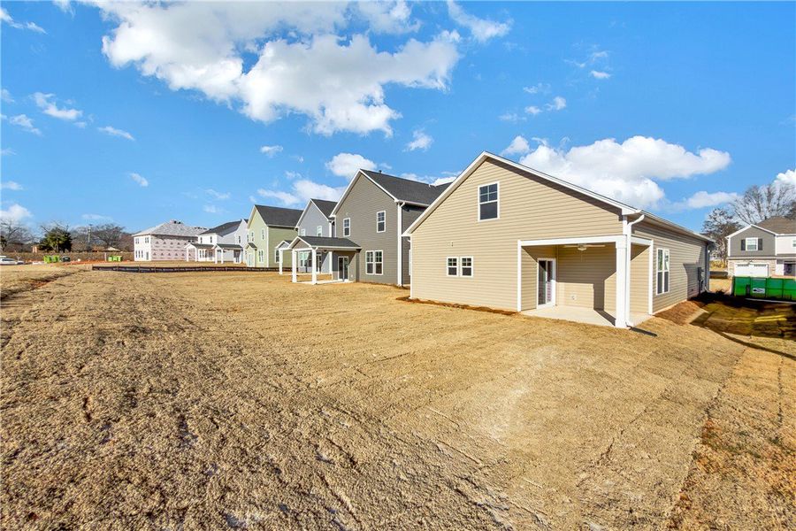 Exterior details and patio area of a home in Brownstone Park, Easley (Image 17).