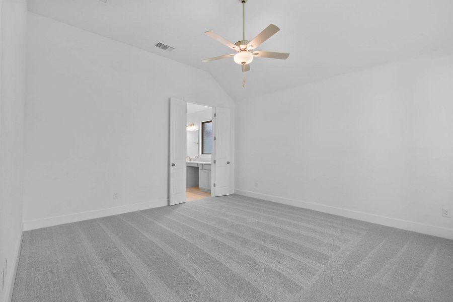 Primary Bedroom with elevated ceiling