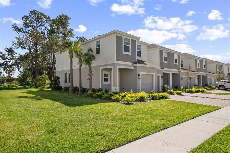 Front exterior of a new home in , Edgewater, FL, highlighting curb appeal (Image 15).