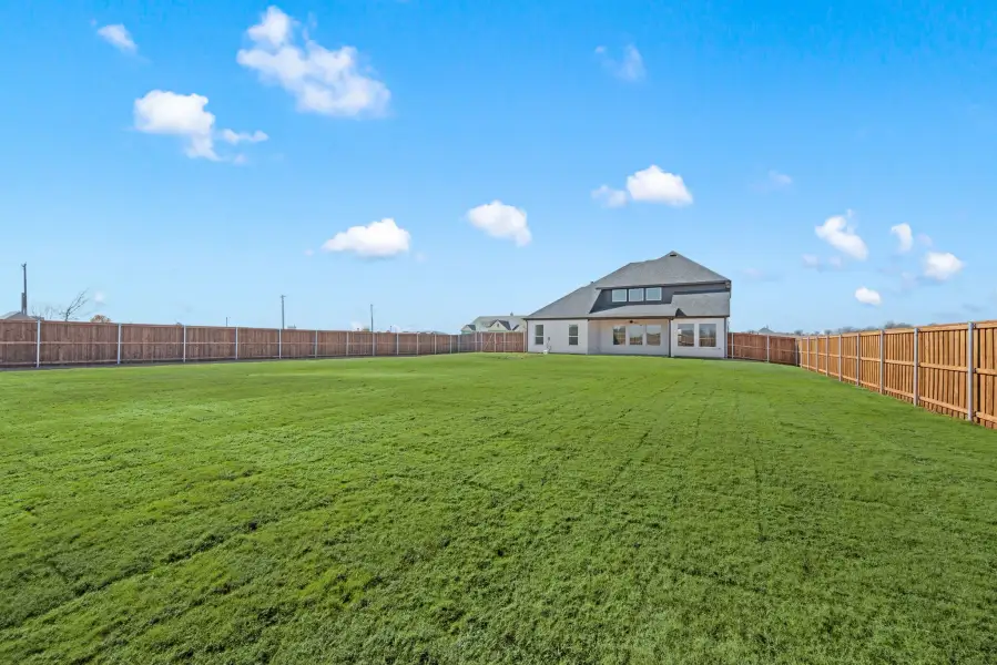 Exterior details and patio area of a home in Settlers Glen, New Fairview (Image 26).