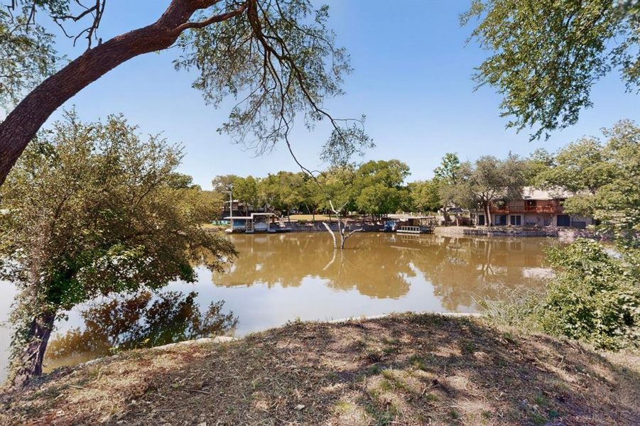 Waterfront property featuring natural surroundings and a visible dock structure