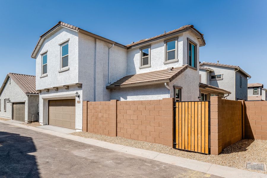 Front exterior of a new home in Avila at Rancho Mercado, Surprise, AZ, highlighting curb appeal (Image 2). Front exterior of a new home in Avila at Rancho Mercado, Surprise, AZ, highlighting curb appeal (Image 2).