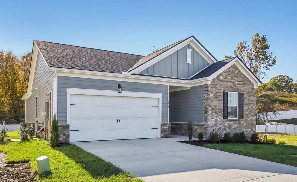 Front exterior of a new home in Cedars at Cane Ridge | 55+ Community, Antioch, TN, highlighting curb appeal (Image 2). Front exterior of a new home in Cedars at Cane Ridge | 55+ Community, Antioch, TN, highlighting curb appeal (Image 2).