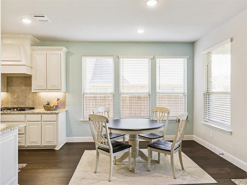 Dining space featuring dark hardwood / wood-style flooring