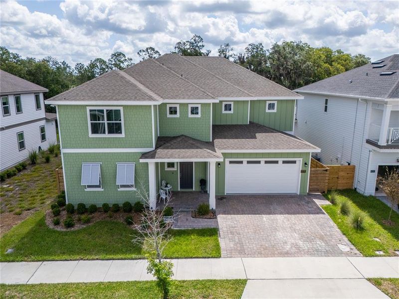 Front exterior of a new home in Weslyn Park at Sunbridge, St. Cloud, FL, highlighting curb appeal (Image 27).