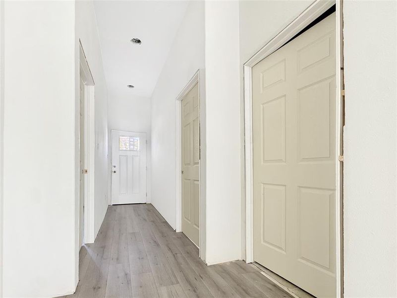 Hall featuring light wood-type flooring Hall featuring light wood-type flooring