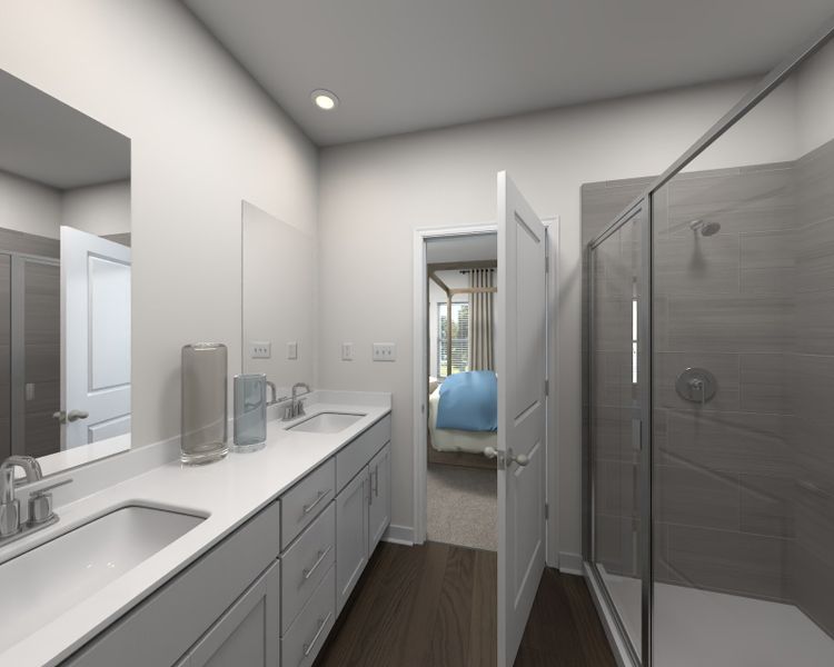 The primary bathroom offers dual vanity sinks and a walk-in closet.