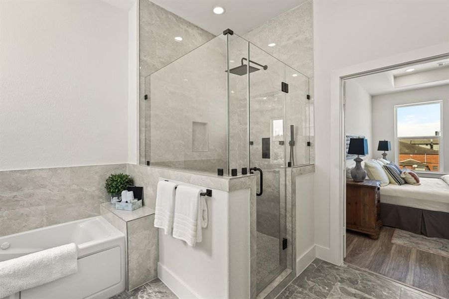 Pamper yourself in this spa-like bathroom! Luxurious fixtures, a deep soaking tub, and elegant tile work make this space a sanctuary. Treat yourself to a soothing bath after a long day