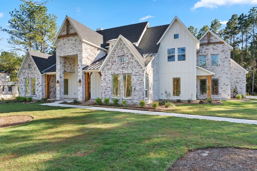 Front exterior of a new home in , Montgomery, TX, highlighting curb appeal (Image 1). Front exterior of a new home in , Montgomery, TX, highlighting curb appeal (Image 1).