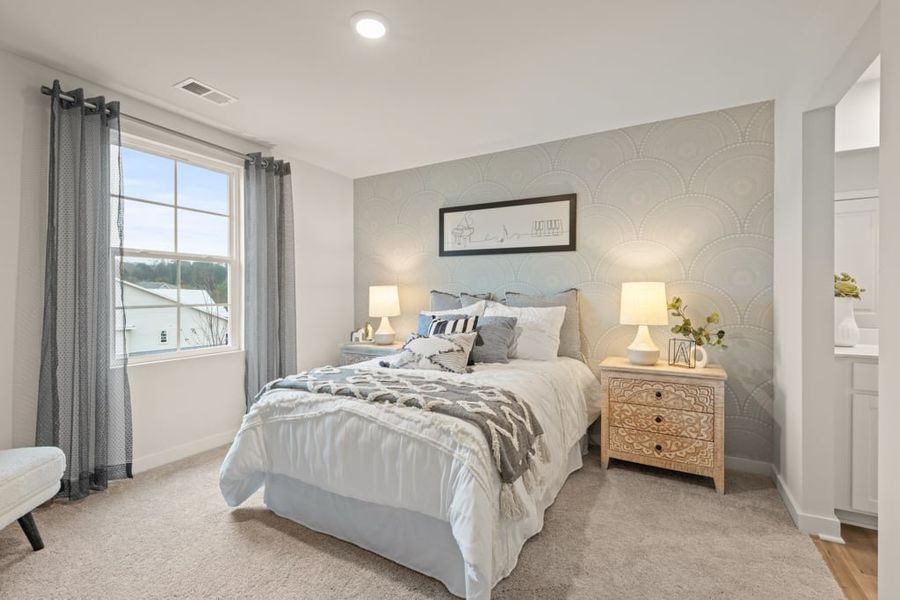 A bedroom with a large bed.