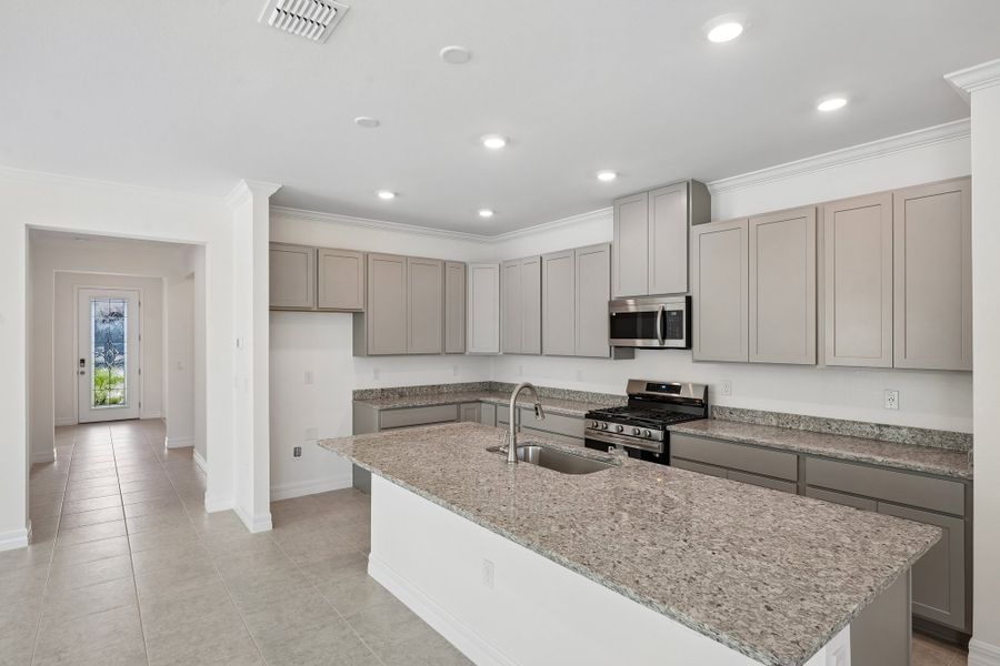 Furnished interior view inside a new home in Heritage Station, Punta Gorda (Image 14).