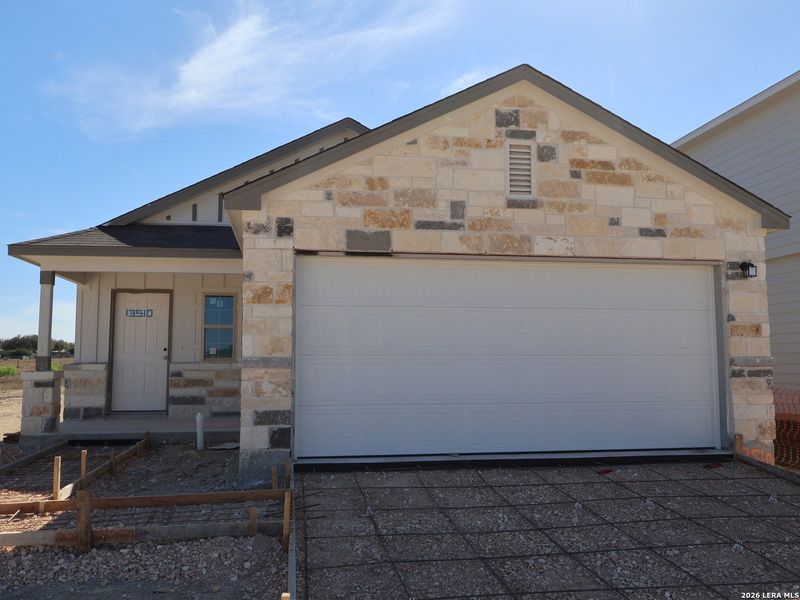 Front exterior of a new home in Winding Brook, San Antonio, TX, highlighting curb appeal (Image 17).