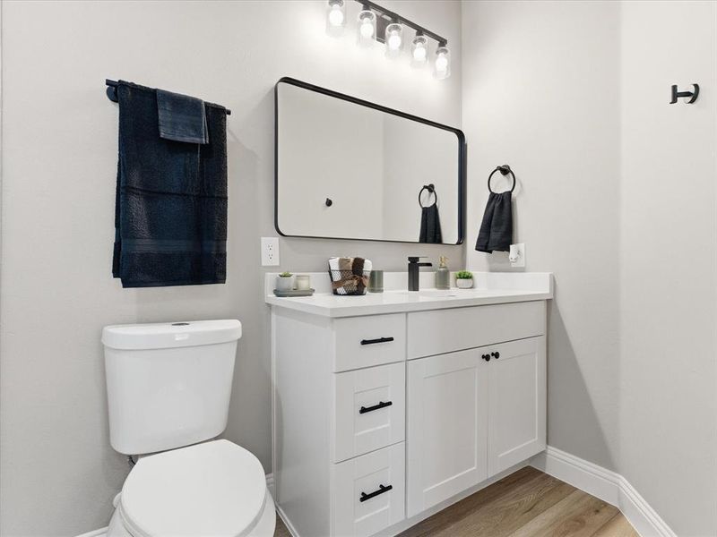 Bathroom with light wood finished floors and vanity Bathroom with light wood finished floors and vanity