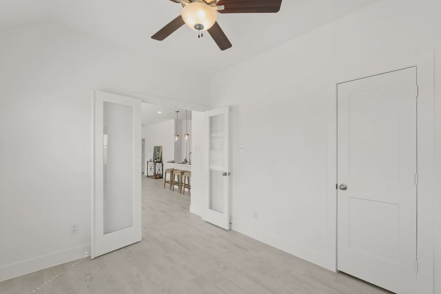 Representative unfurnished interior of a home built from the Chalet by Chesmar Homes in Meridiana Townhomes, Iowa Colony (Image 33).
