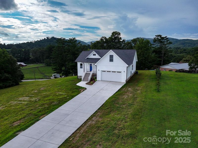Front exterior of a new home in , Hendersonville, NC, highlighting curb appeal (Image 2). Front exterior of a new home in , Hendersonville, NC, highlighting curb appeal (Image 2).
