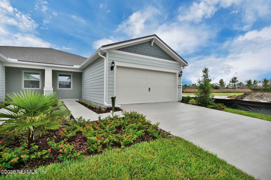 Exterior details and patio area of a home in Del Webb Wildlight, Yulee (Image 20).