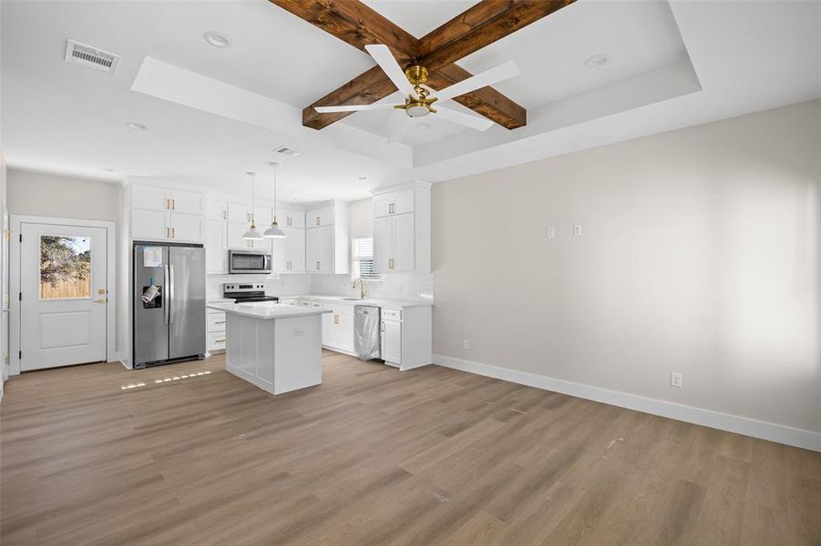 Living room looking into kitchen.