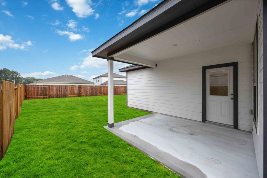 Front exterior of a new home in Granger Pines, Conroe, TX, highlighting curb appeal (Image 14). Front exterior of a new home in Granger Pines, Conroe, TX, highlighting curb appeal (Image 14).