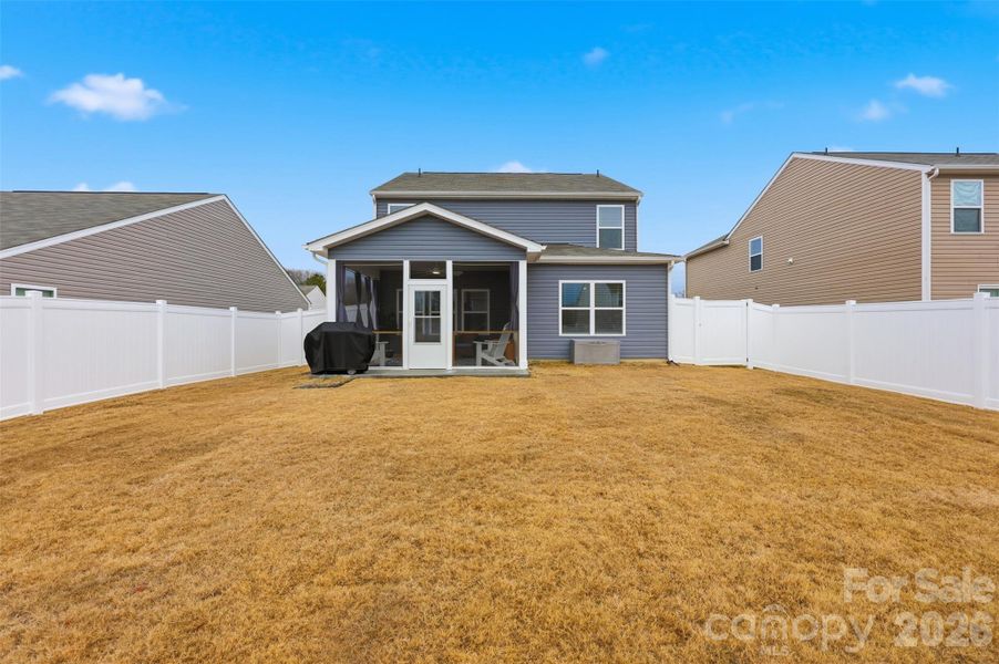 backyard- screened-in porch, extended cement patio, vinyl privacy fence- upgrade added after purchase!